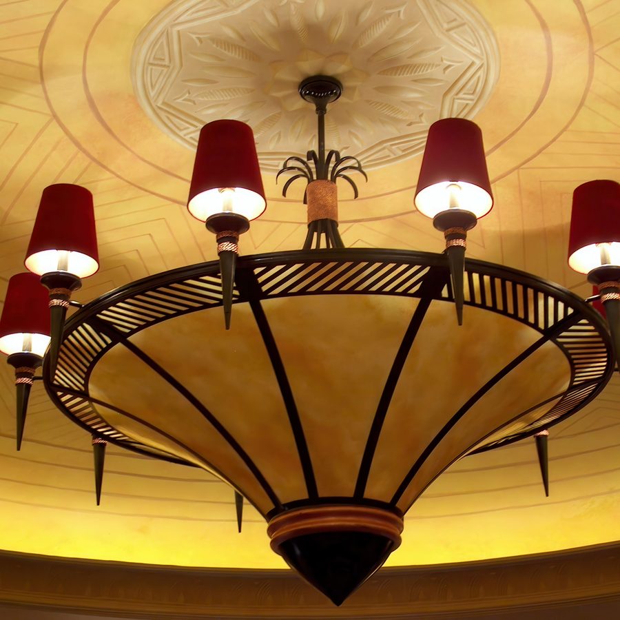 Art deco chandelier with red shades in a casino salon prive